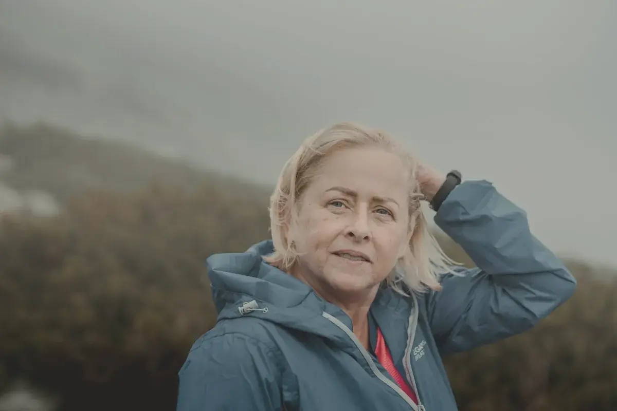 Woman in blue jacket smiling
