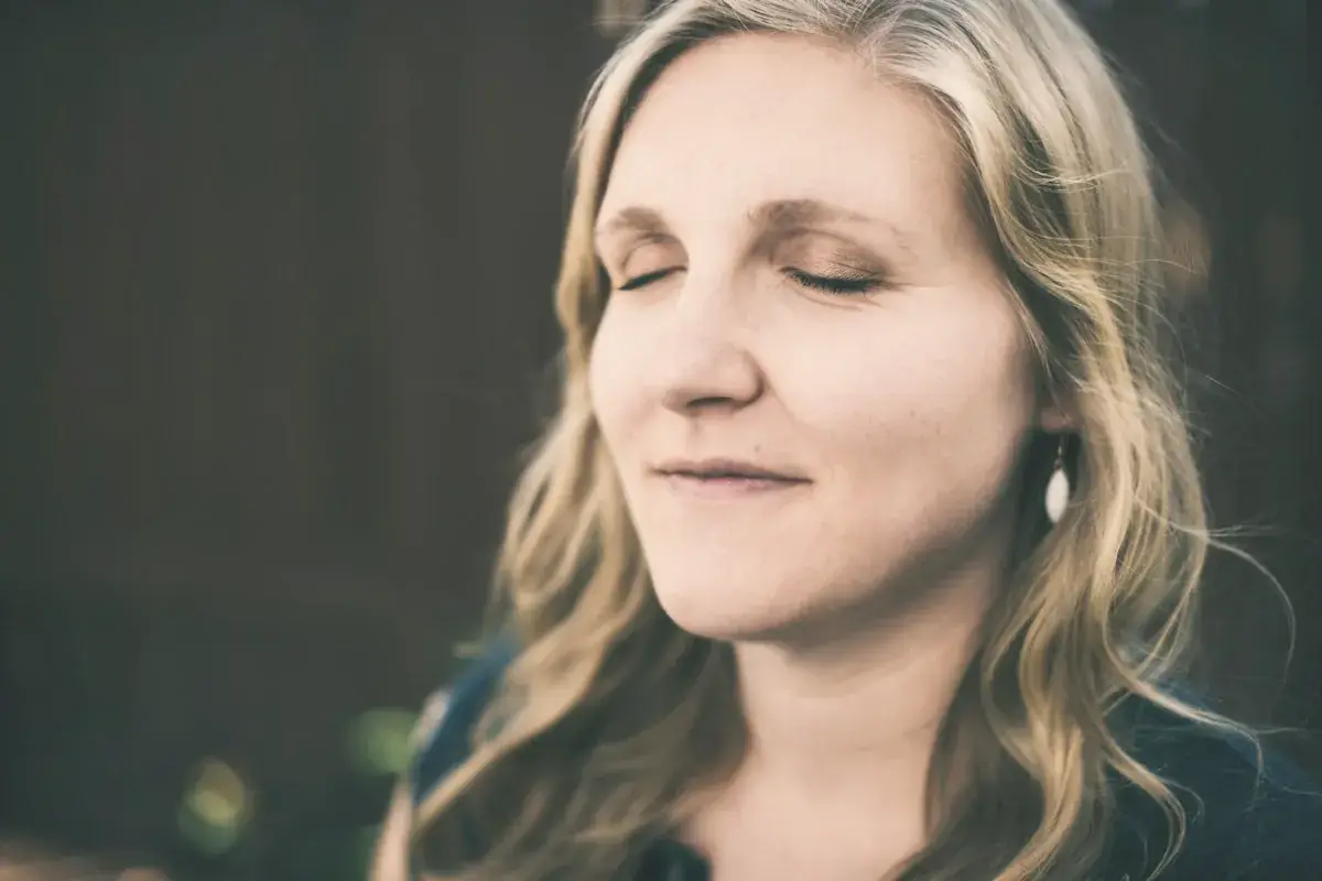 A close up of a person with a cell phone